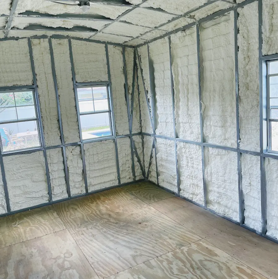 Closed-cell spray foam insulation applied to wall cavities in a residential project in Mendota